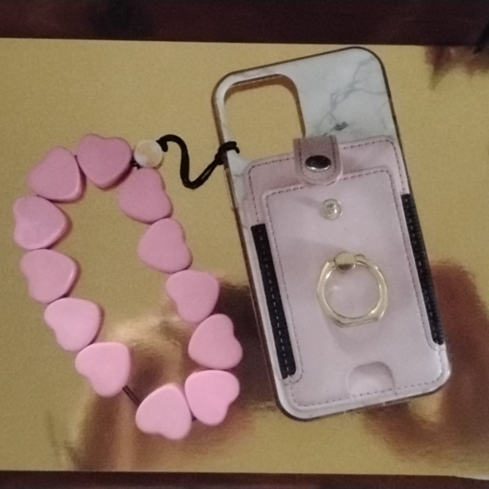 I phone 12 case wallet and wrist band all together very clean smoke free home.